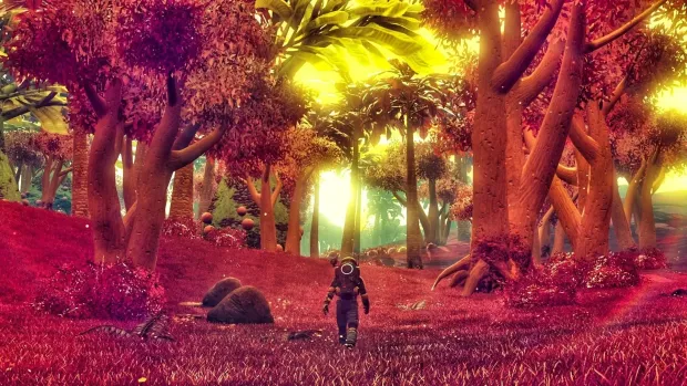 A traveller walking beneath golden alien trees